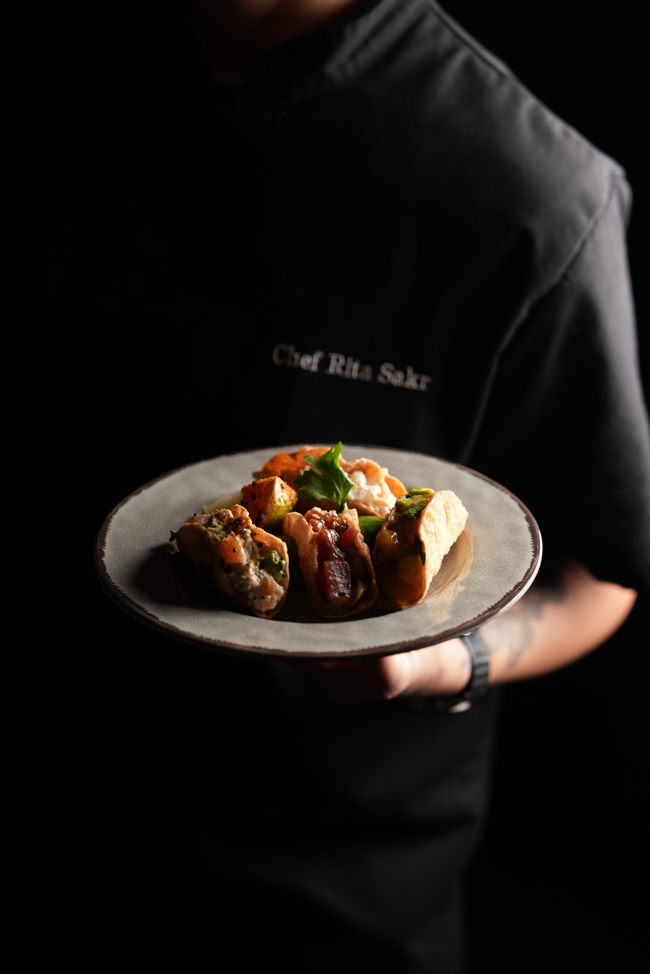 Chef presenting a plated dish