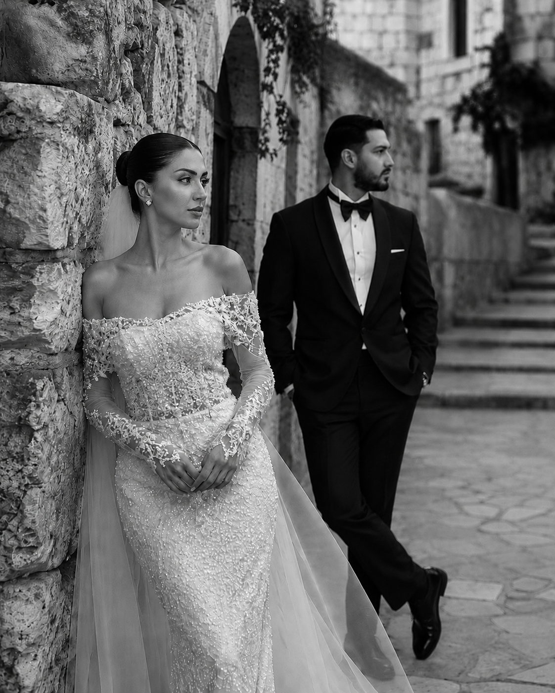 Bride and groom portrait against stone walls