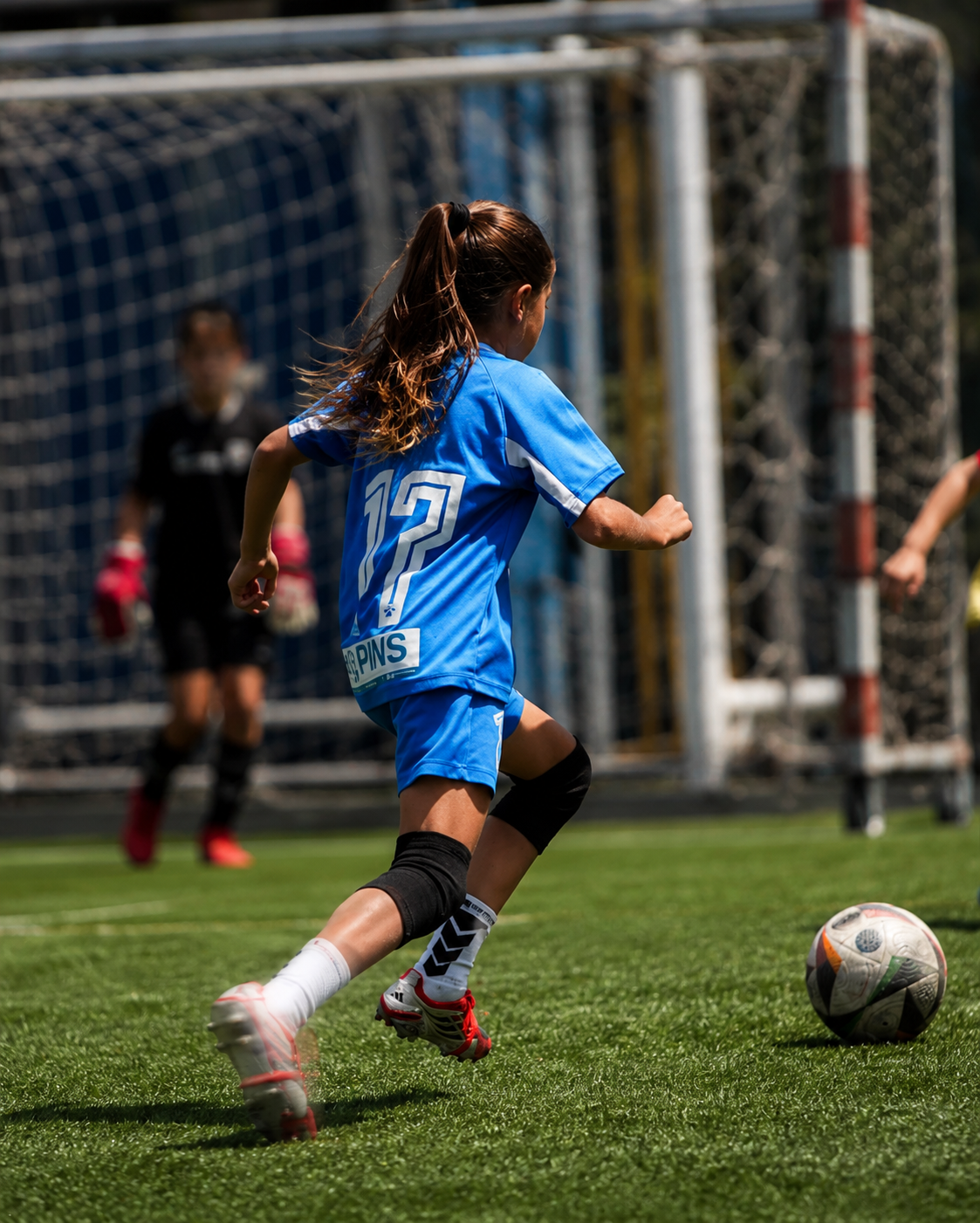 Young player chasing the ball during a match